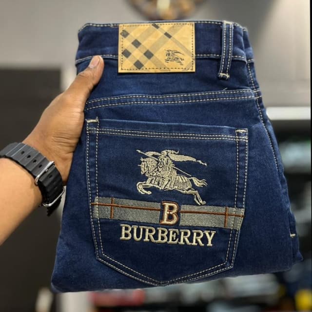 Dark blue denim with beige, brown, and off-white accents Jeans