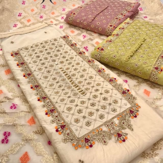 Ivory, gold, orange, maroon, pink and green Salwar Kameez