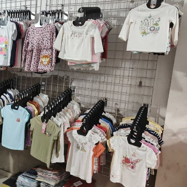 Various, including white, pink, blue, green, and orange T-shirts and tops