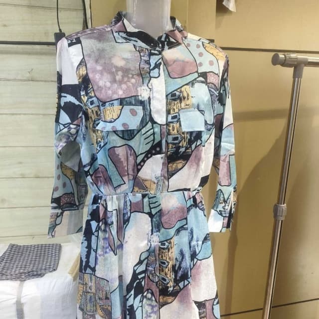 Multi-color, featuring light blue, purple, beige, and touches of black and yellow. Dress