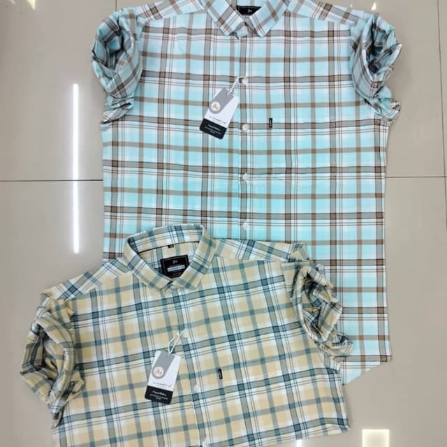 Blue, brown, and white in a checkered pattern; yellow, green, and white in a similar pattern. Shirt