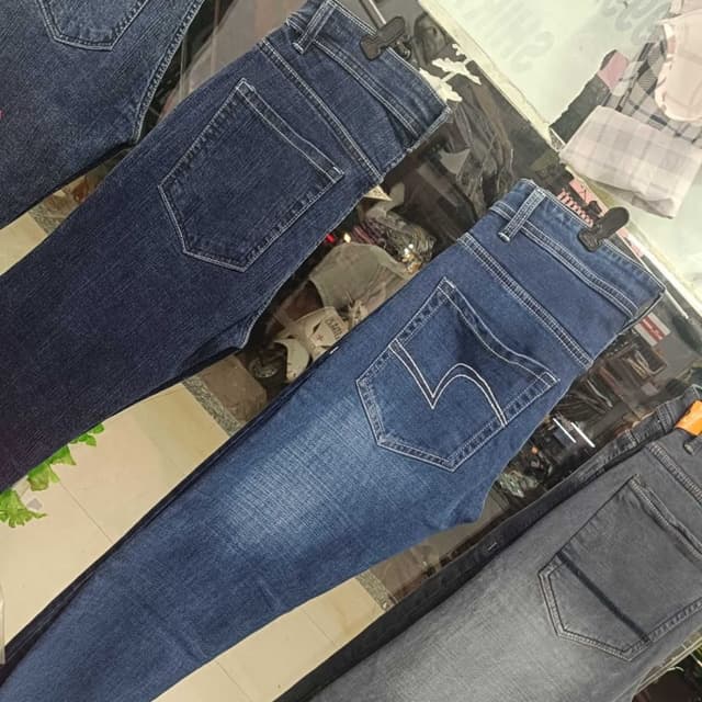 Various shades of blue, ranging from dark indigo to faded blue and grey. Jeans