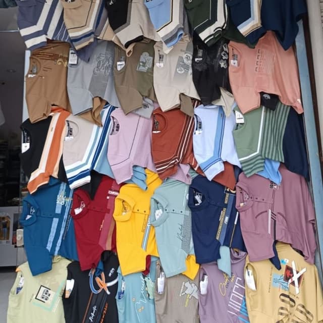 Various, including blues, reds, yellows, greens, and neutral tones like beige and gray, with stripes and color blocking. T-shirts