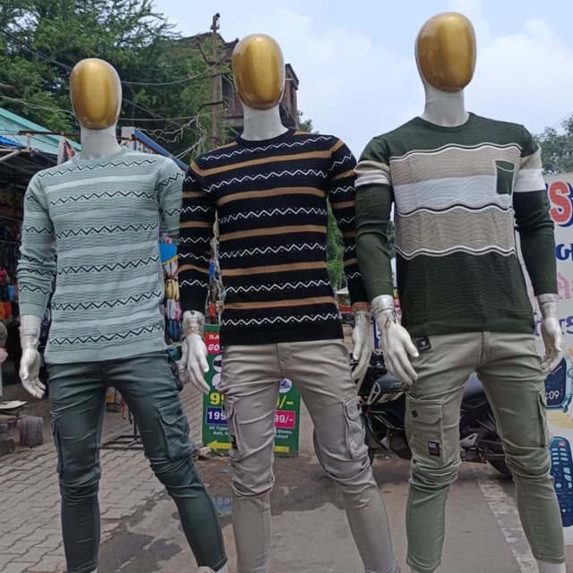 Various, including Green, Black, Beige, White, and Gold Sweaters and Cargo Pants