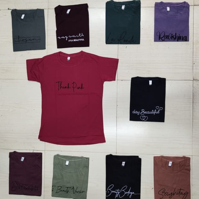 Various solid colors including maroon, black, purple, dark green, brown, olive green, and grey T-shirts