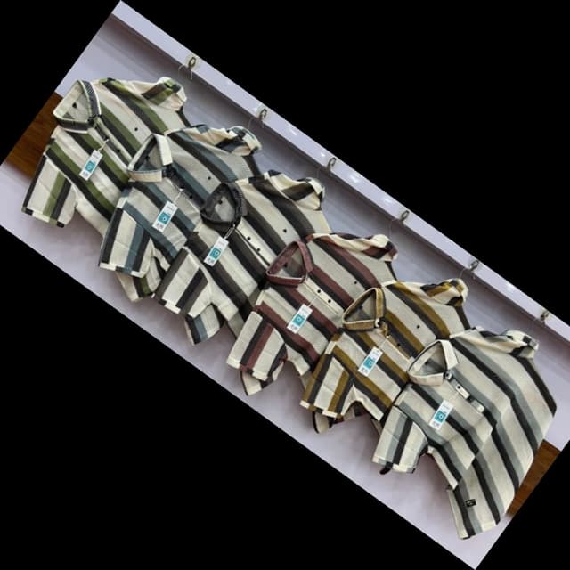 Various, with stripes of green, black, white, gray, brown, and tan. Shirt