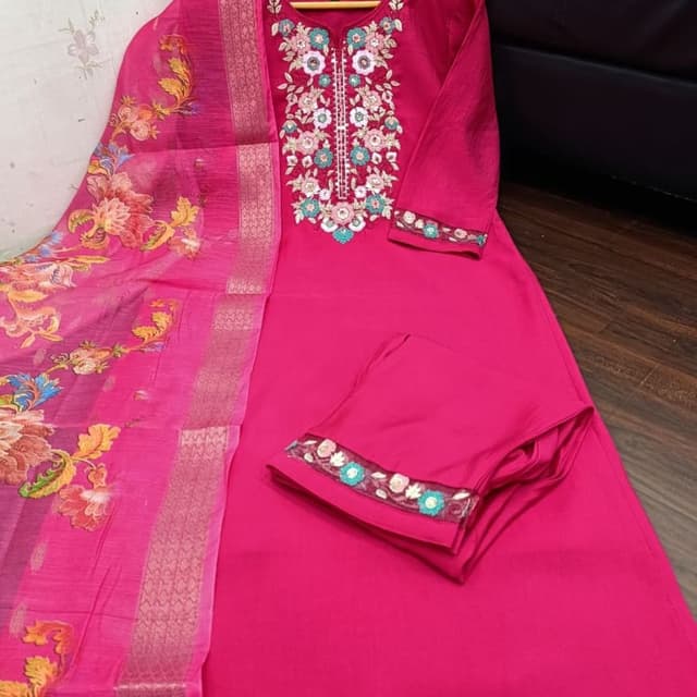 Magenta, with accents of various colors in the embroidery and dupatta Salwar Kameez Suit