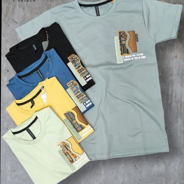 Various - Including shades of Green, Black, Blue, and Yellow. T-Shirt
