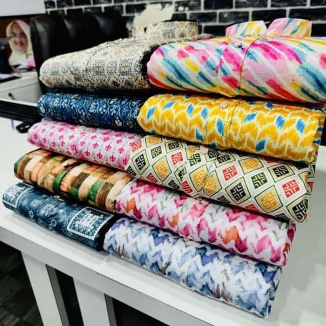 Various vibrant colors and patterns including blue, yellow, pink, and brown Shirt
