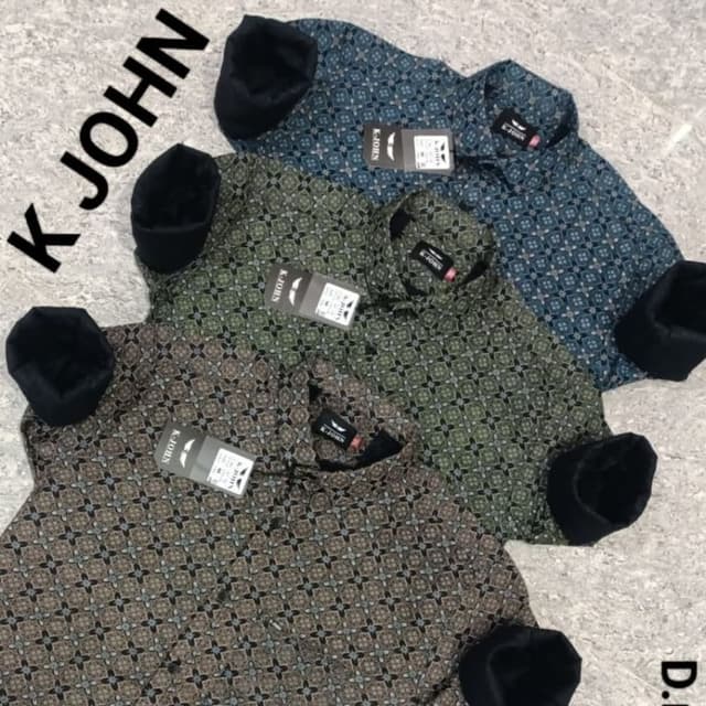 Various shades of blue, green, and brown with black cuffs Shirt