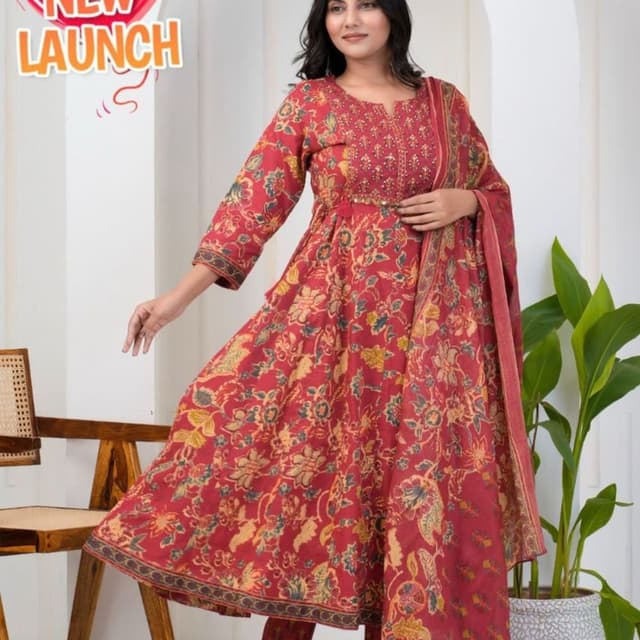 Red, with hints of yellow and green in the floral print, and dark brown accents. Anarkali Suit Set