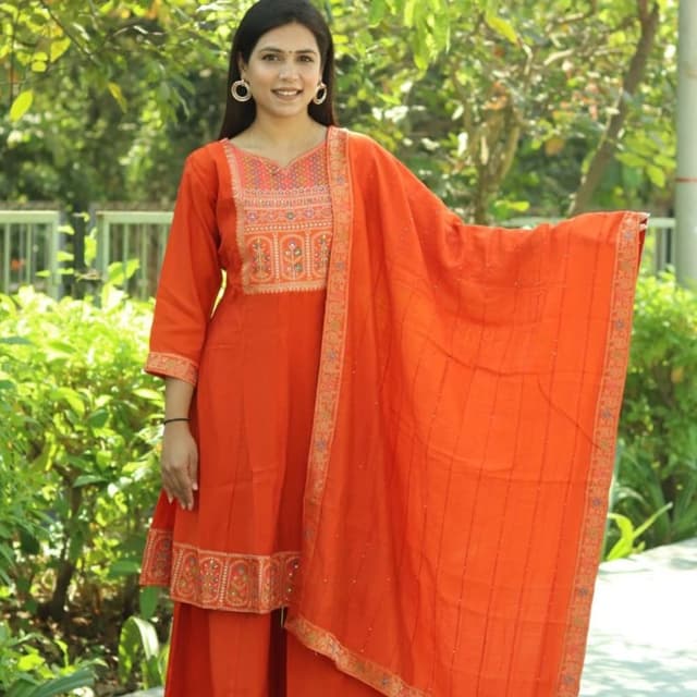 Orange, with hints of other colors in the embroidery Salwar Kameez with Dupatta