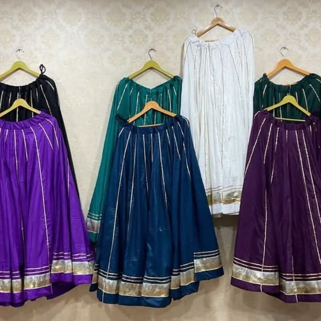Variety of colors including purple, black, green, navy blue, and white with golden accents. Skirt