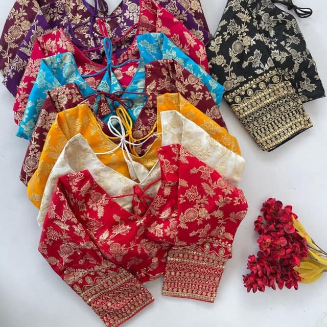 Various, including red, yellow, gold, black, purple, blue, and white, all with gold accents. Blouse