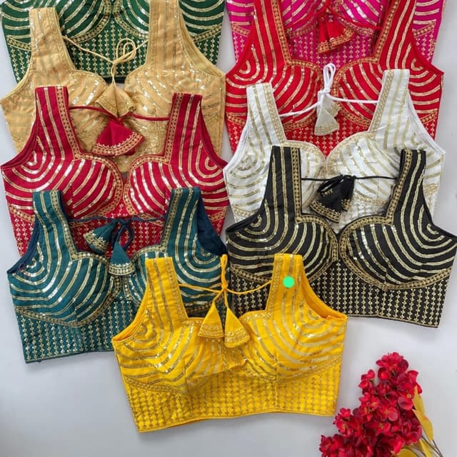 Various, including Green, Gold, Red, Pink, White, Black, and Yellow with Gold accents. Blouse