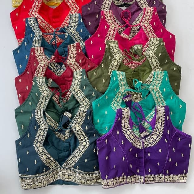 Various, including red, teal, burgundy, purple, olive green, emerald green, and fuchsia. Blouses
