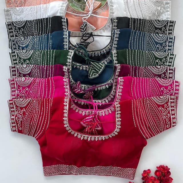 Various, including red, pink, dark green, teal, black, and peach with silver embroidery Blouse