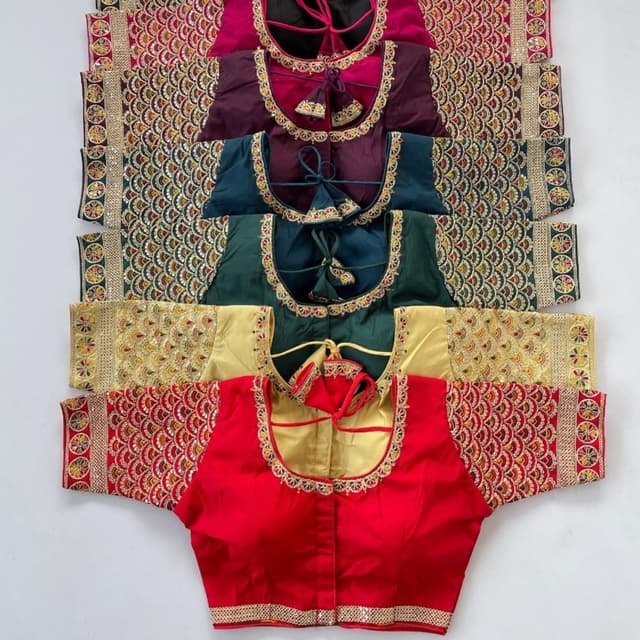 Various, including red, gold, green, teal, purple, and black with gold and other contrasting embroidery. Blouses