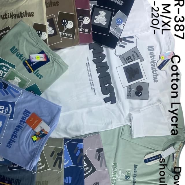 Various pastel colors including white, green, blue, brown, and grey with black and white graphics. T-shirts