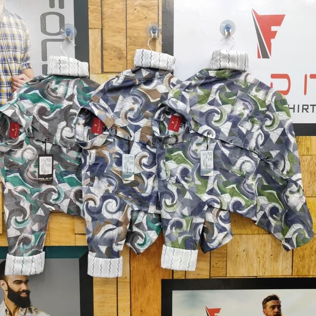 Cool tones of blue, gray, and green with hints of brown. Shirt