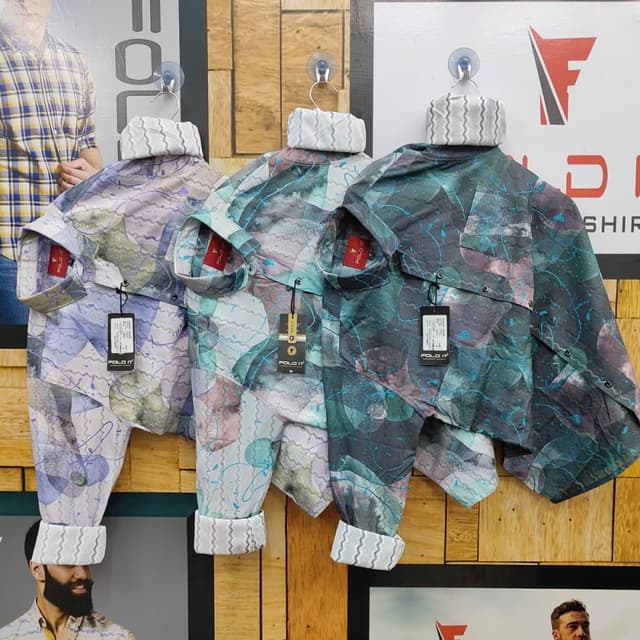 Multi-color with dominant shades of blue, green, and purple combined with lighter hues and hints of brown. Shirt