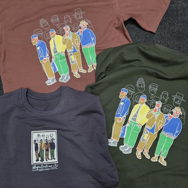 Various, including shades of brown, green, and blue, with graphic elements in yellow, green, brown, and blue T-shirt