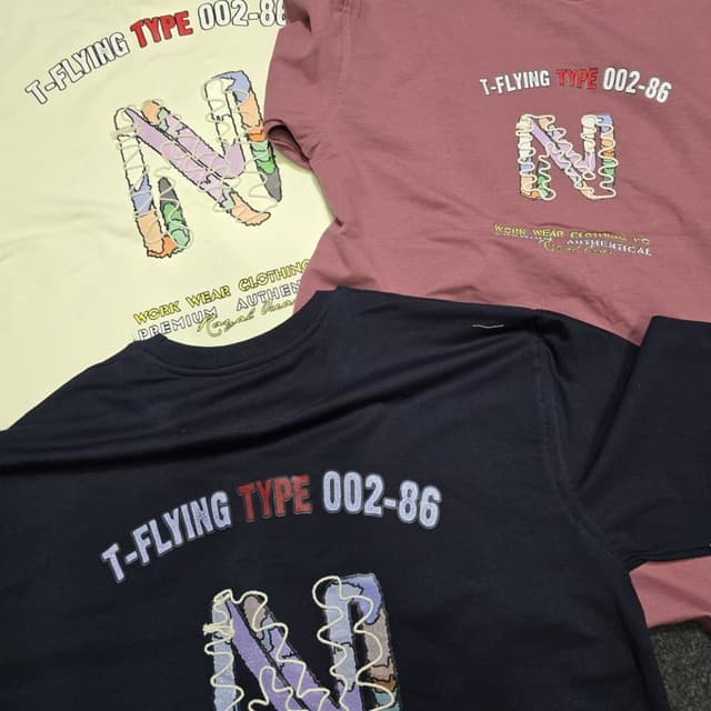 Various - Yellow, Pink, and Navy blue base colors with multi-colored embroidery. T-shirt