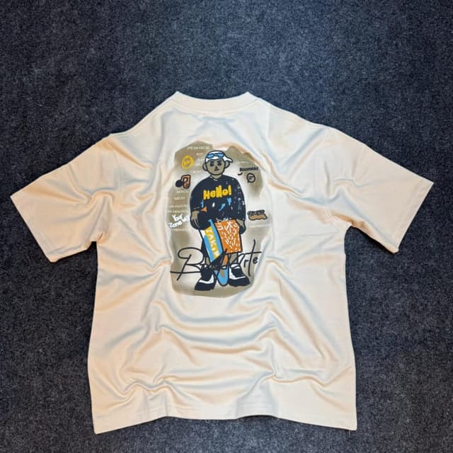 Cream base with a multi-colored graphic T-shirt