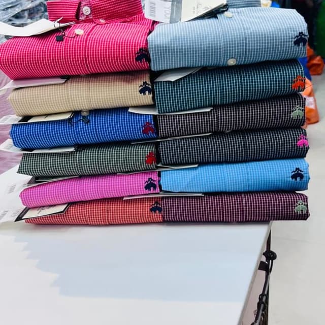Various, including Pink, Blue, Beige, Green, Black, Light Blue, Red, and Purple Shirt