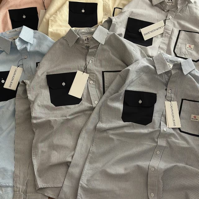 Various pastel colors including blue, pink, and yellow, with black accents. Shirt