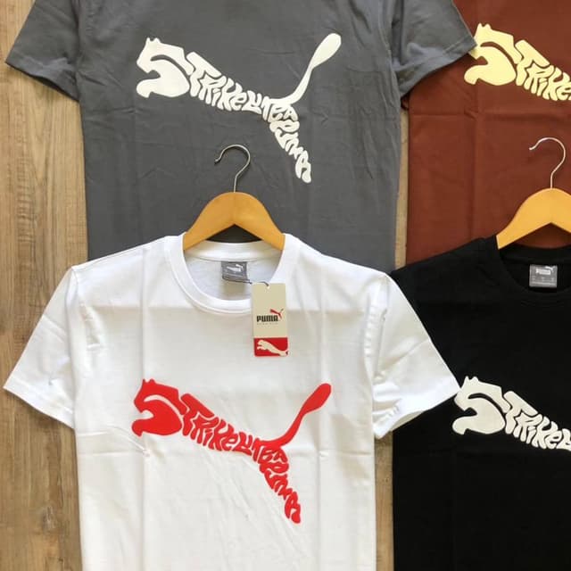 Variety of solid colors (white, black, gray, brown) with contrasting logo colors (red, white) T-shirt