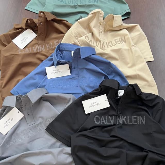 Various solid colors including brown, beige, blue, grey, and black Polo Shirt