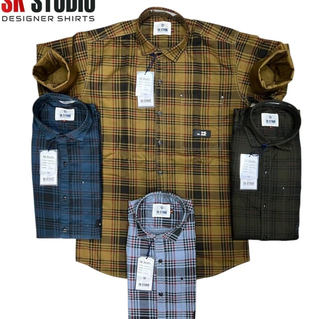 Various plaid patterns with dominant colors including shades of brown, blue, green, and gray. Shirt