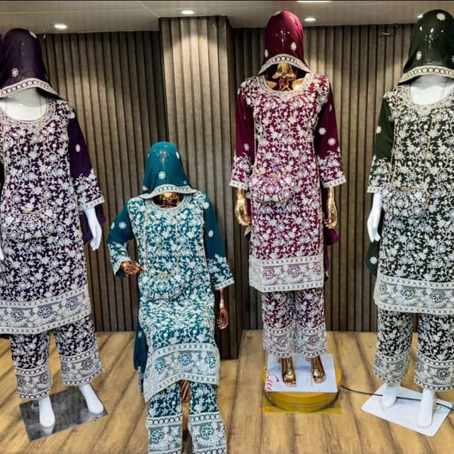Various shades including purple, teal, and dark green with white embroidery. Salwar Kameez Suit