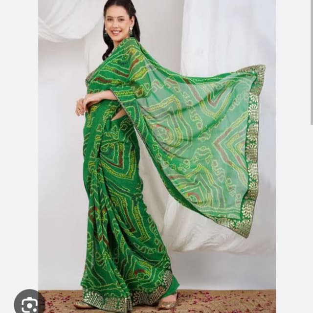 Green, with accents of yellow, red and gold Saree