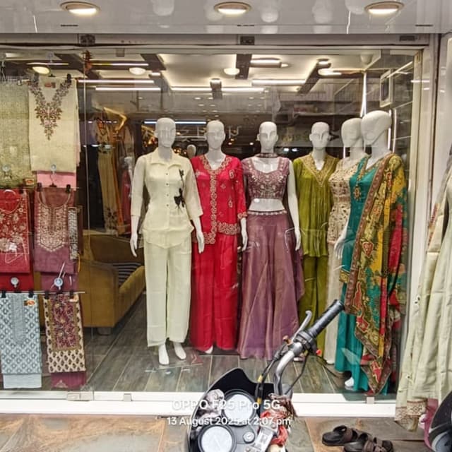 Various, including cream, red, purple, and green with a multi-colored dupatta. Various Salwar Kameez and Lehenga Sets