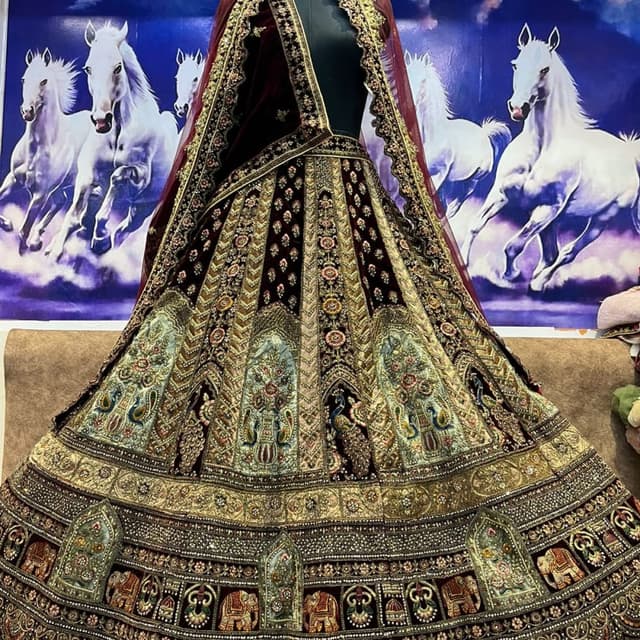 Burgundy, Gold, Teal, and hints of other jewel tones Lehenga Choli