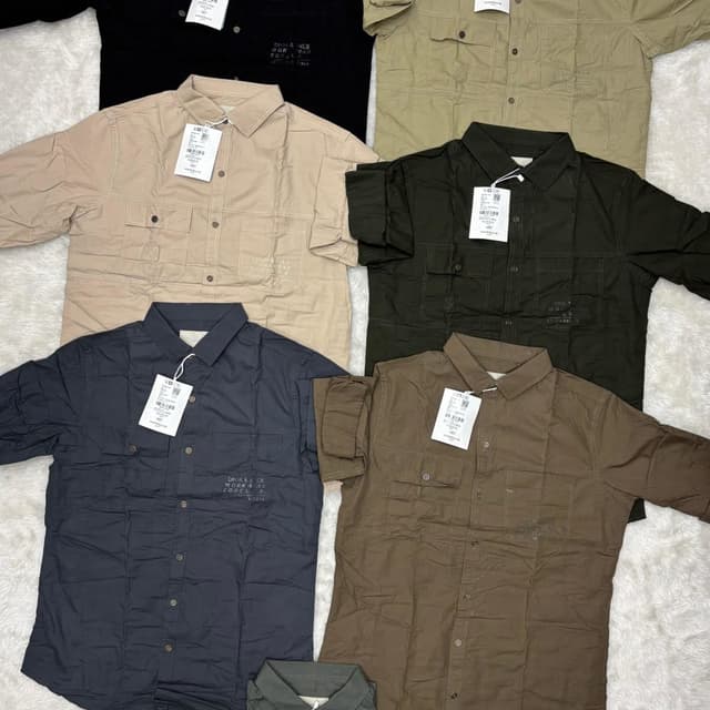 Various solid colors including black, beige, olive green, dark grey, and brown. Shirt