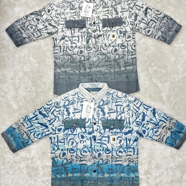 White, gray, and blue with abstract graffiti-style print. Shirt