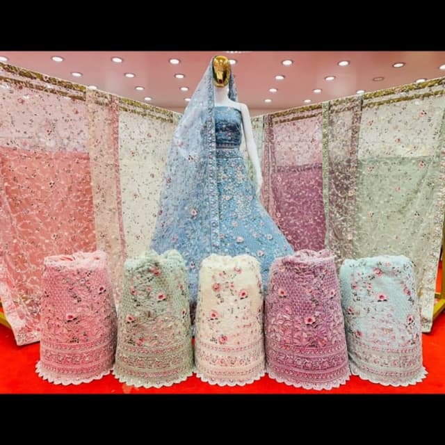 Various pastel shades including light blue, pink, mint green, off-white, and purple. Lehenga Choli