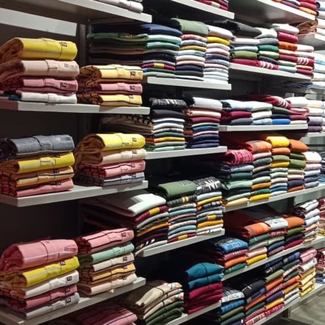 Various, including yellow, pink, blue, green, and neutral tones Shirts