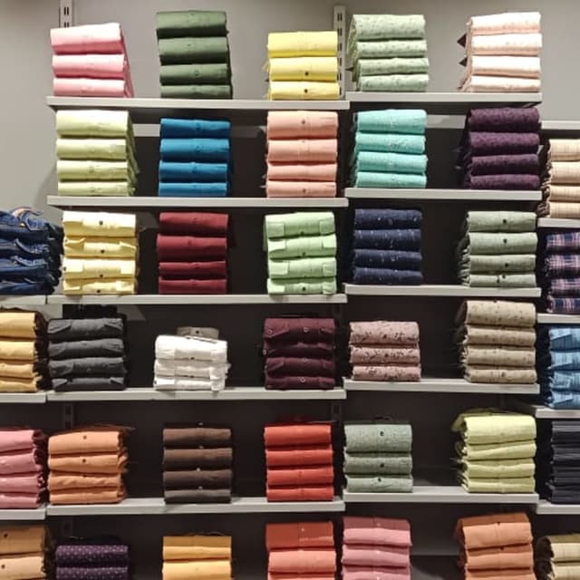 Wide range of solid colors including pink, green, yellow, blue, red, purple, brown, black, white, and various shades in between. Shirts