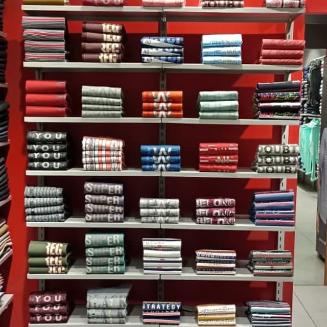 Various colors including red, white, blue, black, green, gray and more. Many items have striped patterns. T-shirts