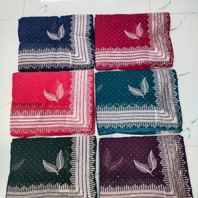 Various, including navy blue, red, dark green, teal, and deep purple with silver embellishments Saree