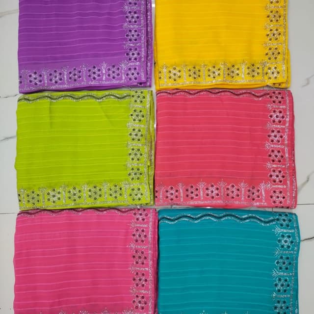 Various bright colors including purple, yellow, green, pink, and turquoise Saree