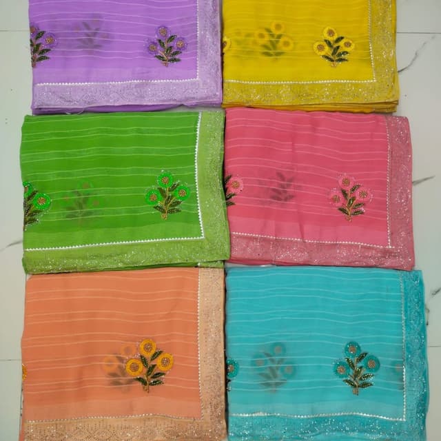Variety of colors including purple, yellow, green, pink, peach, and turquoise Saree