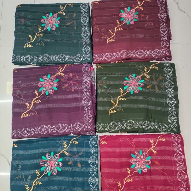 Various shades including Bottle Green, Maroon, Purple, Teal, and Red with complementing embroidery colors. Saree
