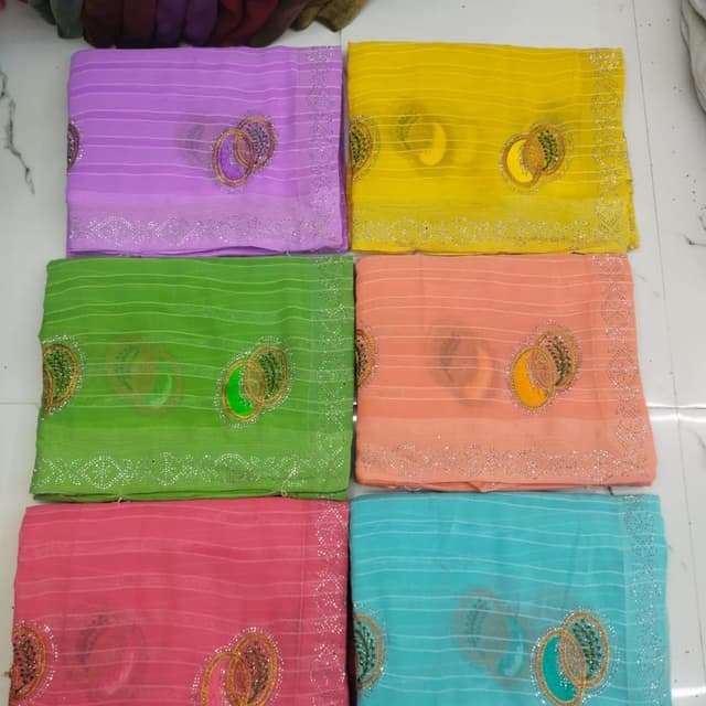 Various pastel shades including purple, yellow, green, peach, pink, and blue Saree