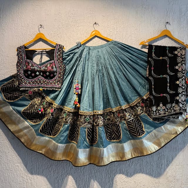Teal, Black, Gold, and a touch of multicolored accents. Lehenga Choli with Dupatta