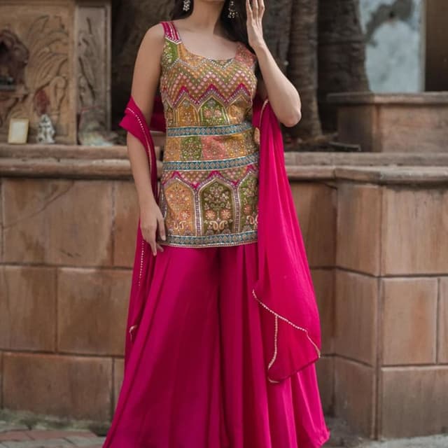 Multicolor top with a pink palazzo and dupatta. Sharara Set